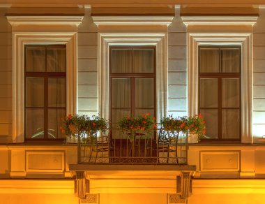 Balcony on night facade of Kempinski Hotel Moika 22 clipart