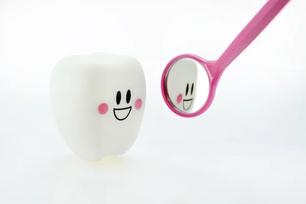 Tooth with dental mirror — Stock Photo, Image