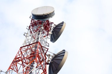 Telecommunication antenna tower on the white sky clipart