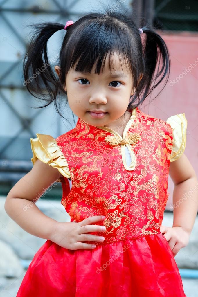 Little Girl In Red Chinese Dress Stock Photo C Oatsung 99615398