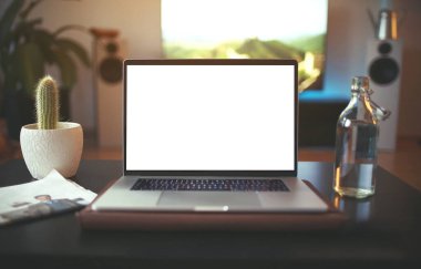 Work from home concept, home office with laptop computer with white screen display