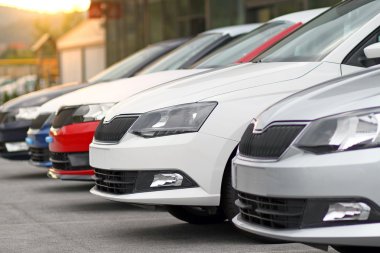 New cars for sale parked in front of a car, motor dealer store, shop clipart