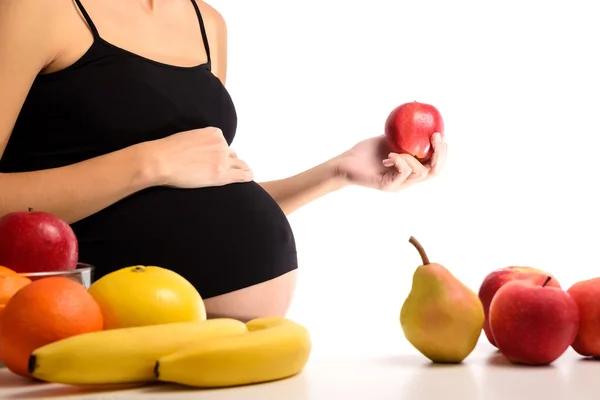 Alimentation saine et grossesse. Femme enceinte et pomme rouge — Photo