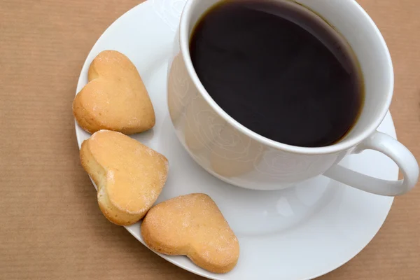 Fechar-se de xícara de café e biscoitos — Fotografia de Stock