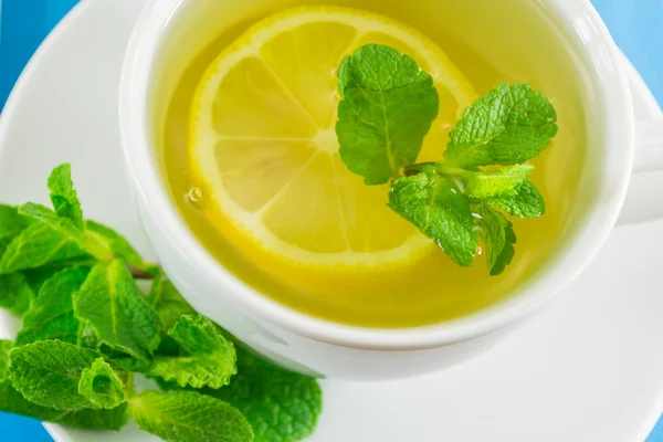 Cup of tea with lemon and mint — Stock Photo, Image