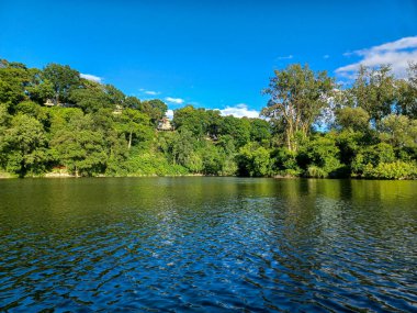 : View of the Humber River under a clear blue summer sky.