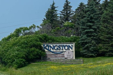 Kingston, ON, Canada - September 18, 2025: A welcome sign for the city of Kingston is visible from a highway on a cloudy day.