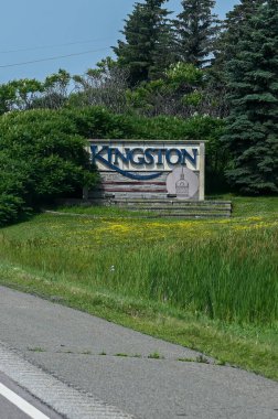 Kingston, ON, Canada - September 18, 2025: A welcome sign for the city of Kingston is visible from a highway on a cloudy day.