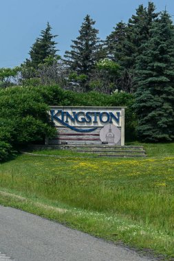 Kingston, ON, Canada - September 18, 2025: A welcome sign for the city of Kingston is visible from a highway on a cloudy day.