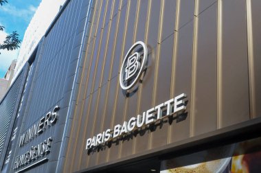 Toronto, ON, Canada - September 18, 2025: A modern Paris Baguette bakery and cafe sign with a logo is shown on the building's exterior.