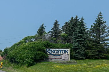 Kingston, ON, Canada - September 18, 2025: A welcome sign for the city of Kingston is visible from a highway on a cloudy day.