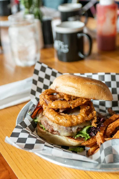 Gourmet BBQ Onion Ring Hamburger With Fries — стокове фото