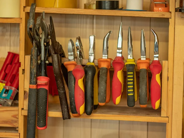 Pliers Different Types Sizes Hang Row Wooden Shelf Carpentry Shop — Stock Photo, Image