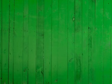 Geçmişi ve dokusu. Yeşil boyayla boyanmış ahşap çitler. Boşluğu kopyala.