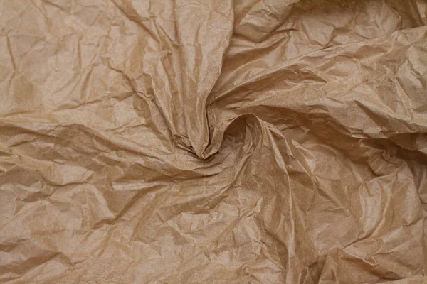 Crumpled paper. craft paper. texture, background, folds.brown crumpled paper — Stock Photo, Image