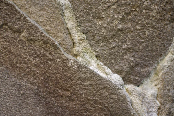 A natural stone. wall, foundation. masonry. large stone — Stock Photo, Image