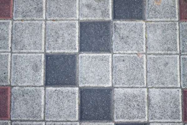 Outdoor tile laying. tile. tiled road. repair, construction. — Stock Photo, Image