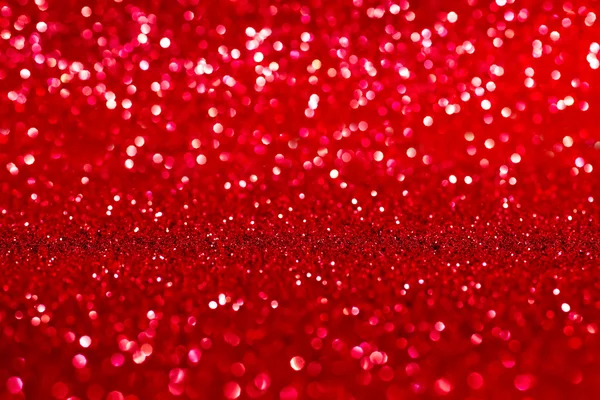 Red shiny glitter defocused background — Stock Photo, Image