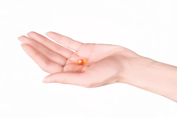 Hand with capsule — Stock Photo, Image