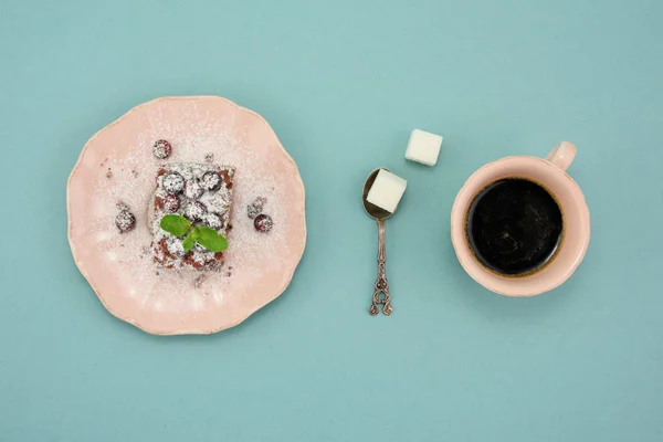 Chocolate dessert, cup of coffee and fresh cranberry over black background. Top view. — Φωτογραφία Αρχείου