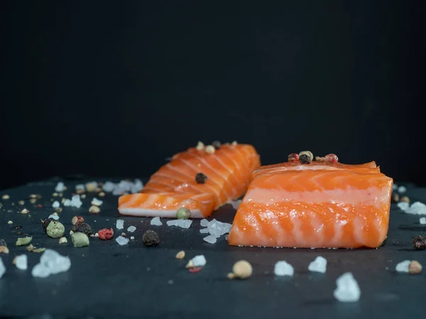 Close up raw salmon fillet with spices. — Stock Photo, Image