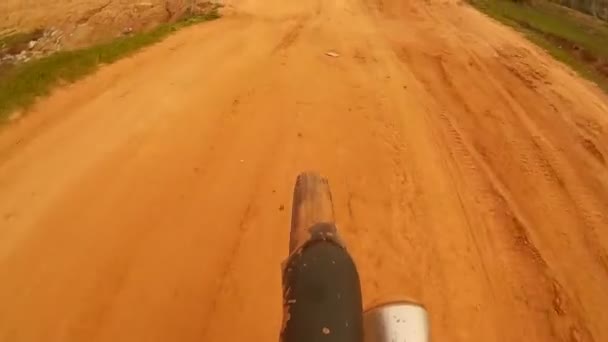 SIEM REAP, CAMBODIA - CIRCA JULY 2016: Riding dirt road in Southeast Asia action cam POV with tire and passing moto — Stock Video