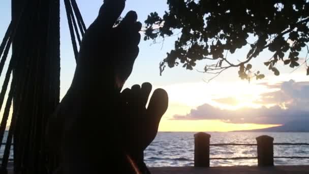 MCU feet crossed in sea side hammock (point of view perspective) — Stock Video