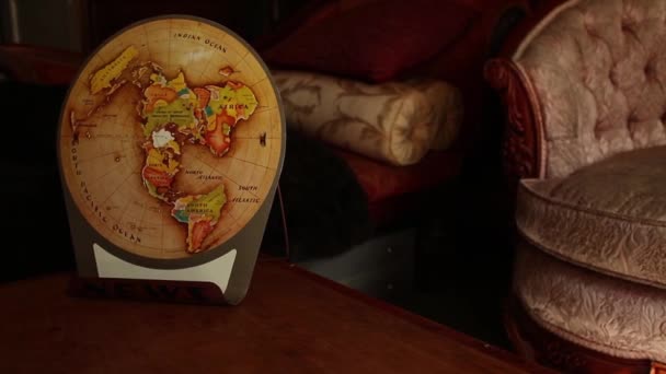 Camera dolly move in to retro vintage world map, settle closer — Stock Video