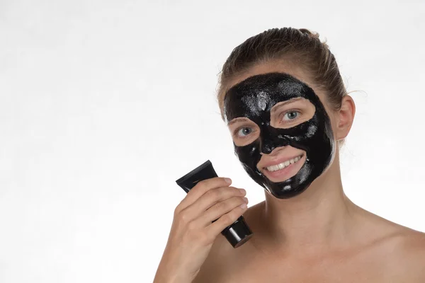 Happy beautiful girl smiling on a white background in a cosmetic — Stock Photo, Image