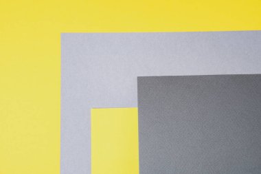 Gri ve sarı kağıt üst manzara. Tasarım için geometrik şekilleri olan bir şablon. Metin için yılın moda rengi ve yeri