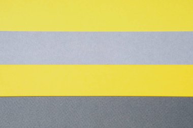 Gri ve sarı kağıt üst manzara. Tasarım için geometrik şekilleri olan bir şablon. Metin için yılın moda rengi ve yeri