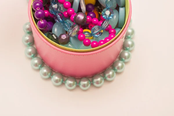 Necklaces and ornaments on a white background — Stock Photo, Image