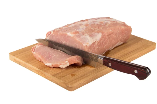Raw piece of meat on a wooden board on a white background Royalty Free Stock Photos