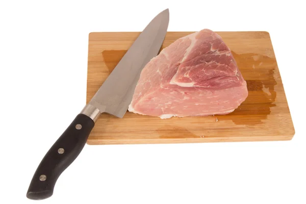 Raw piece of meat on a wooden board on a white background Royalty Free Stock Images