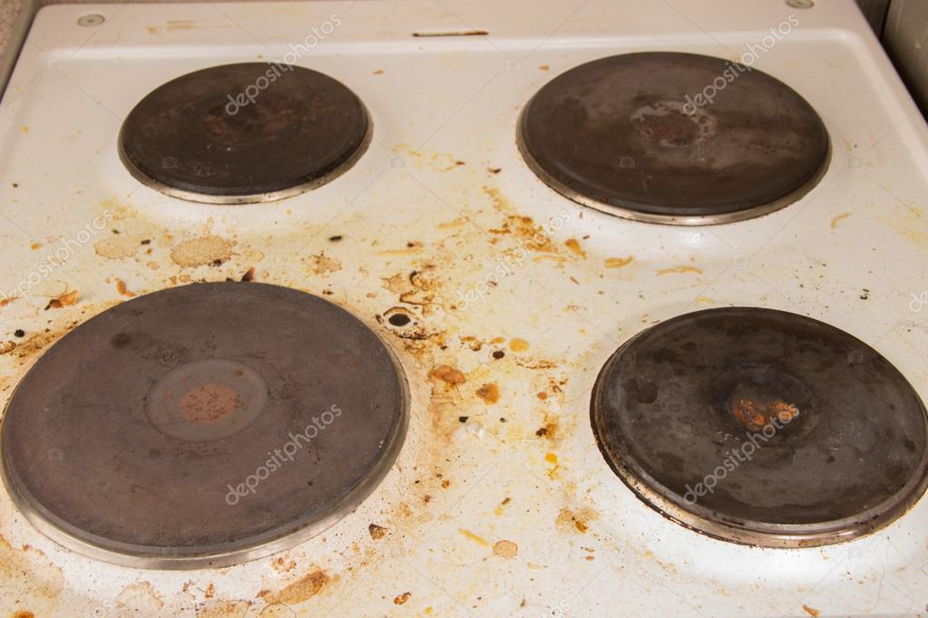 Very dirty stove in the kitchen. Grease after cooking Stock Photo by