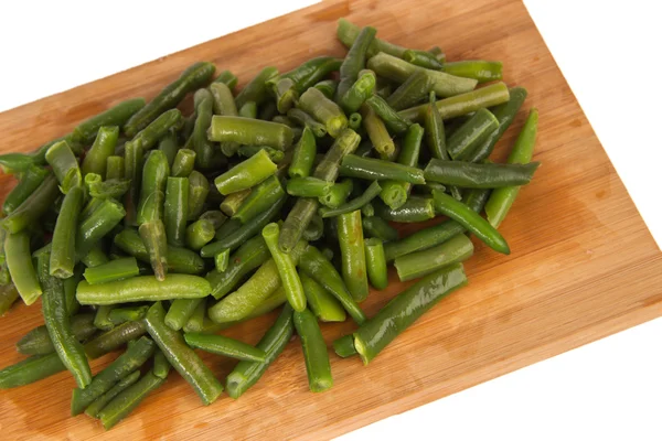 Green string beans on a wooden board — Stock Photo, Image