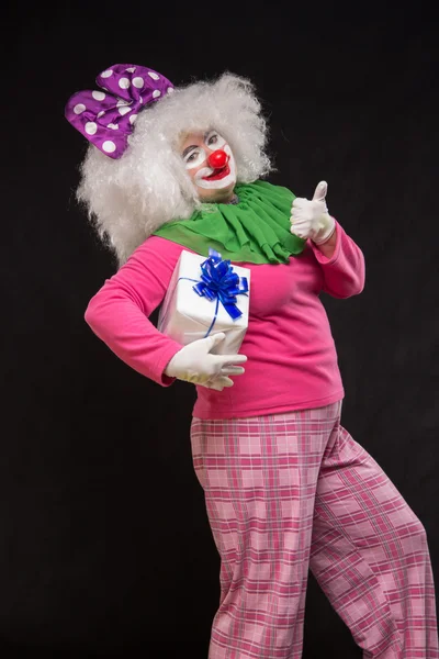 Funny clown with shaggy hair and a cheerful make-up — Stock Photo, Image