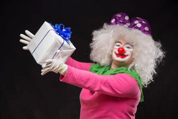 Funny clown with shaggy hair and a cheerful make-up — Stock Photo, Image