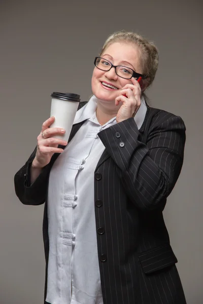 Business fat woman in a suit with a leather briefcase and docume — Stock Photo, Image