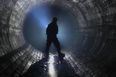 Man in underground river