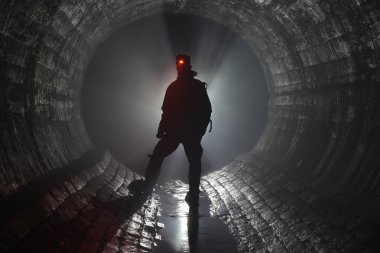 Man in underground river