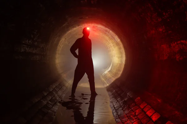 Man in drain — Stock Photo, Image