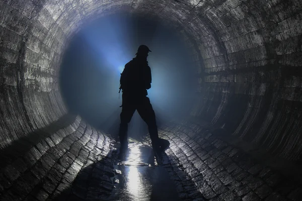 Man in underground river Stock Snímky