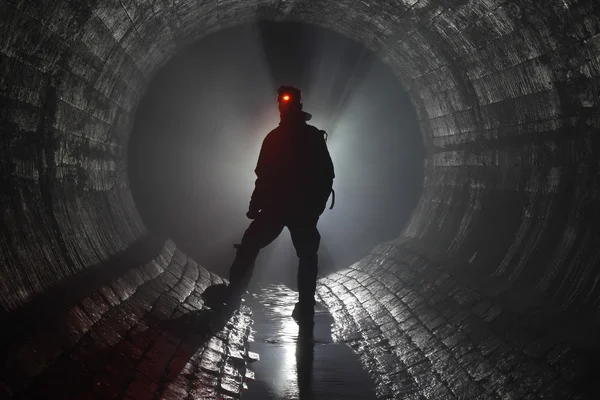 Man in underground river Stock Snímky