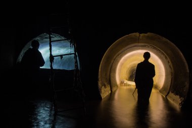 Men in drain