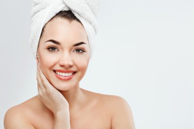 Young girl wearing white towel