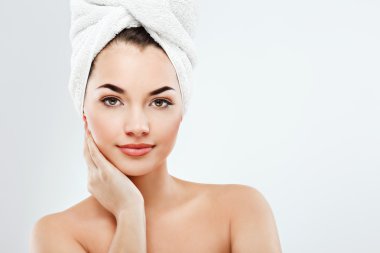 Young girl wearing white towel