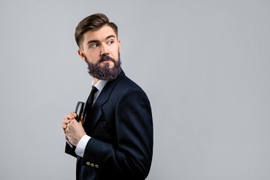 Funny young man holding wallet