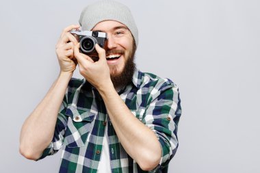 Young laughing man take a picture