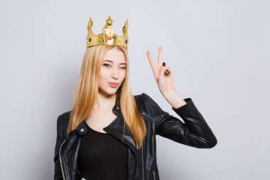 Gorgeous young girl wearing black jacket and crown